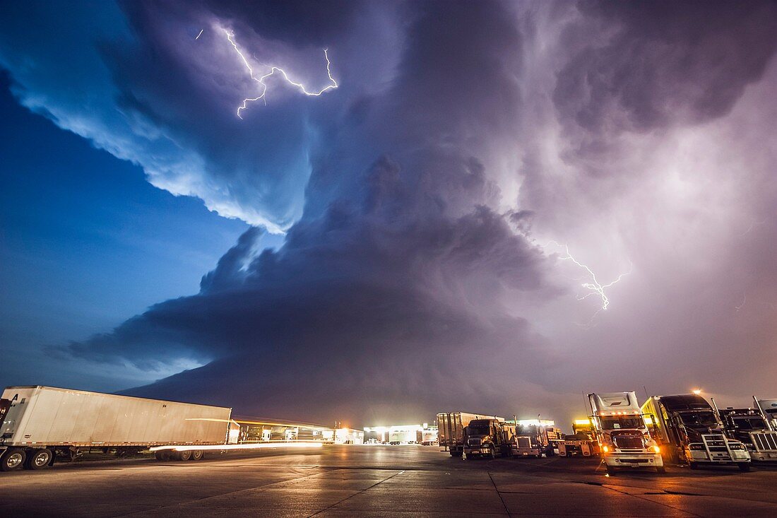 Amazing supercell storm during twilight nears a York Nebraska truck stop on I80 as it spits out lightning, June 17, 2009. Only a half hour or so earlier this storm was producing a long-lived large tornado near Aurora Nebraska.