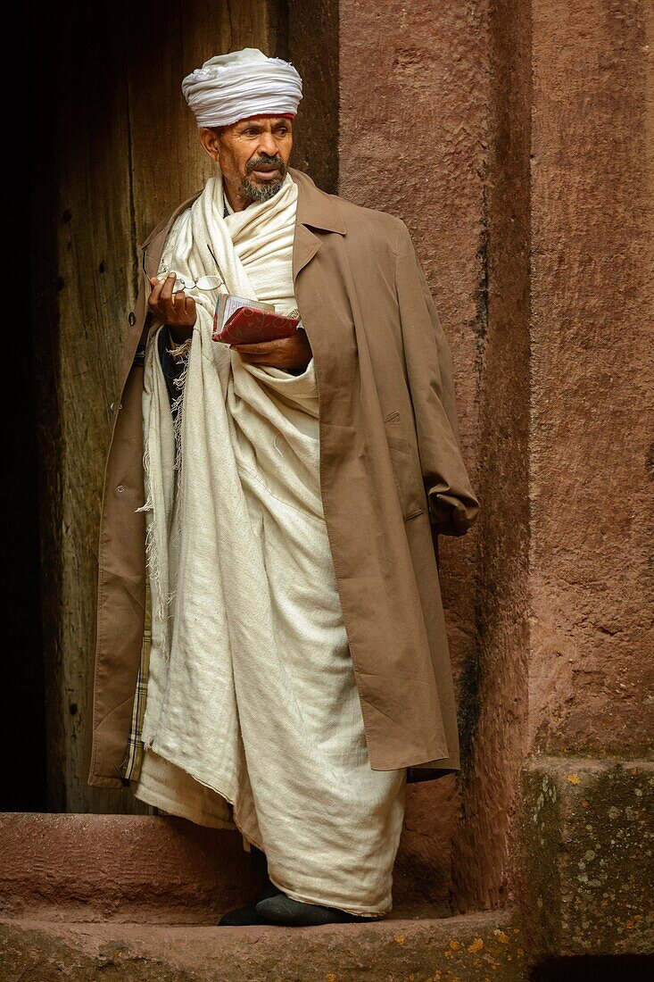 'Priest at Church of St. George (Amharic: Bete Giyorgis or Biet Giyorgis). It is among the best known and last built of the eleven Rock-Hewn Churches in the Lalibela area, and has been referred to as the ''Eighth Wonder of the World''. Lalibela. Ethiopia.