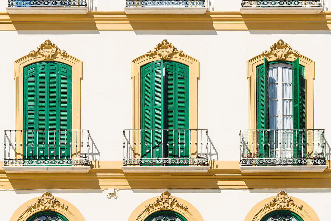 Front of an old house at the famous Plaza de la Merced, Malaga, Andalusia, Spain