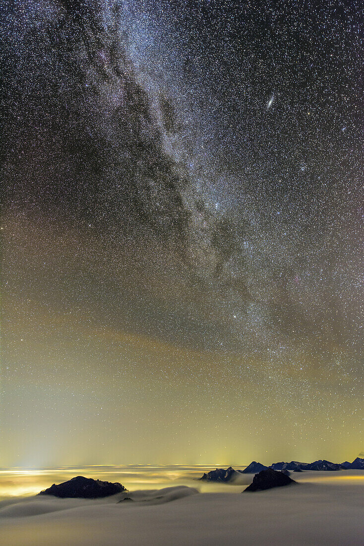 Starry sky with Milky Way above sea of fog with Mangfall range and Chiemgau Alps, Bruennsteinschanze, Mangfall range, Bavarian Alps, Upper Bavaria, Bavaria, Germany