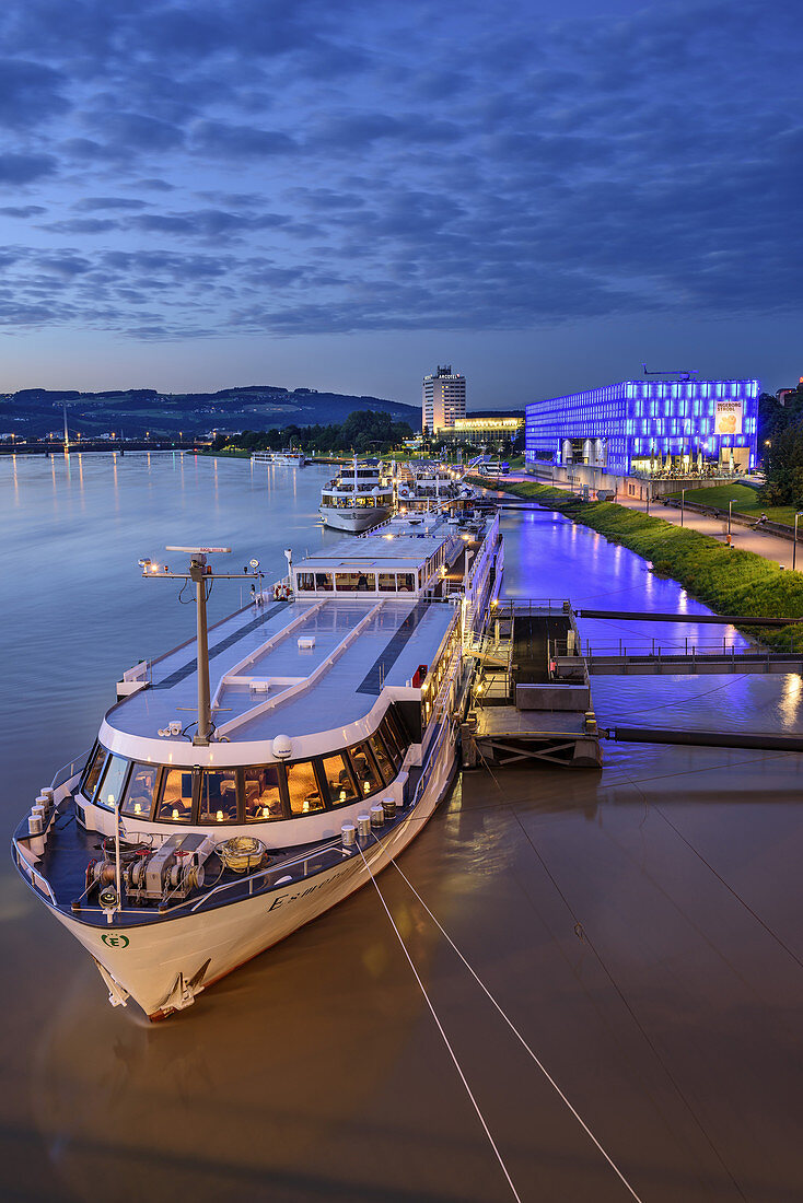 Ships at Danube laying in front of illuminated Lentos Museum, Linz, Danube Bike Trail, Upper Austria, Austria