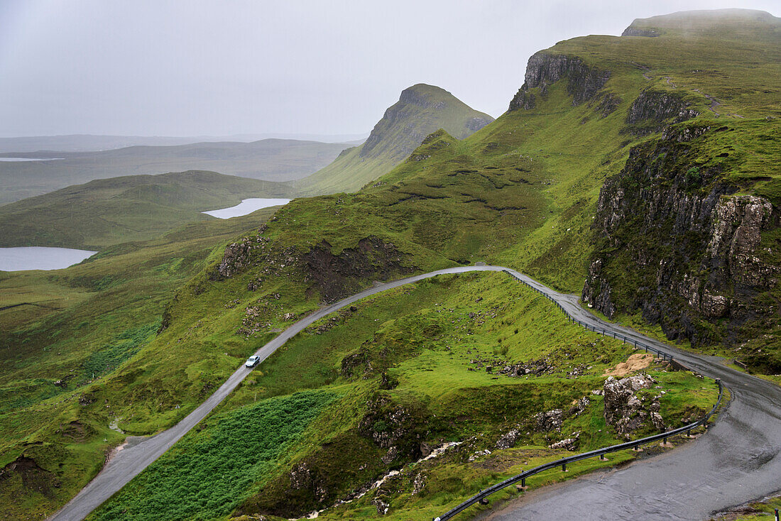 'A road winding through the mountains, Highlands; Staffin, Scotland'