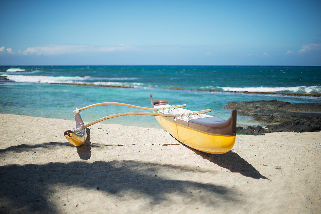 'Outrigger canoe on the beach; Island of Hawaii, Hawaii, United States of America'