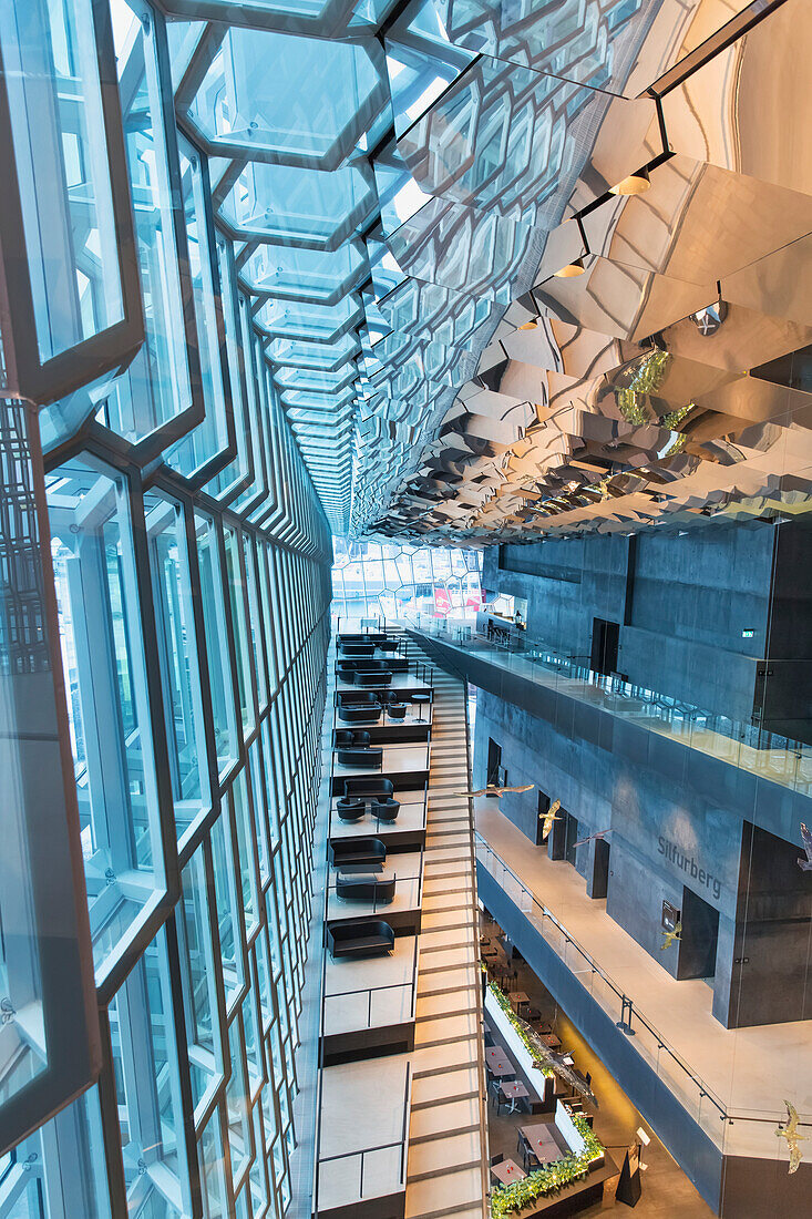 'Interior of the Harpa Public Concert Hall, designed by the Danish firm Henning Larsen Architects and the Icelandic firm Batteriao Architects, the glass facade designed by Icelandic glass artist Olafur Eliasson; Reykjavik, Iceland'