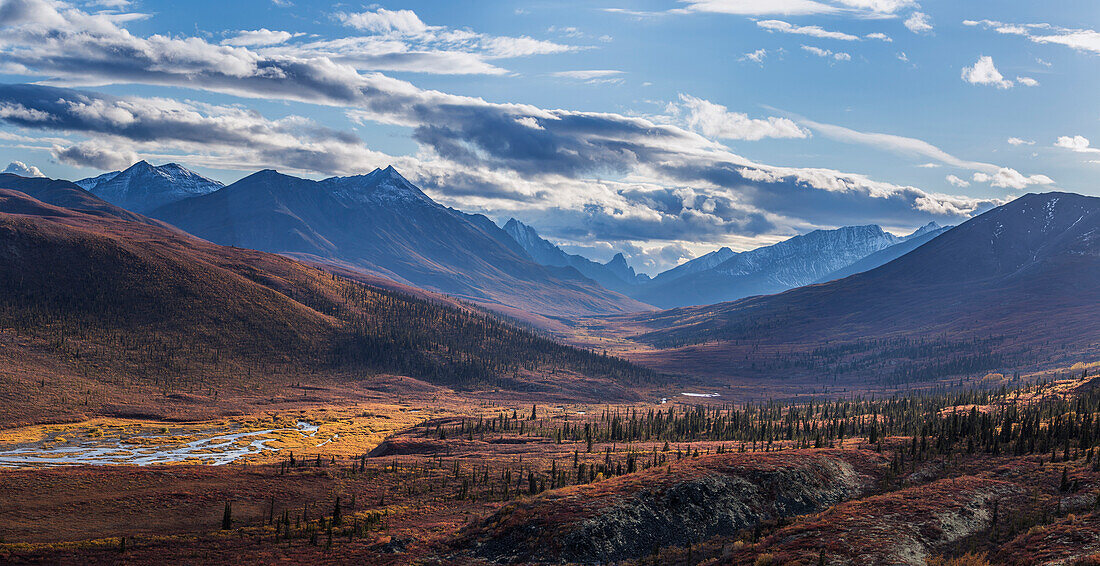 Scenic autumn view of mountains and colorful tundra in Tombstone Territorial Park, Yukon Territory, Canada