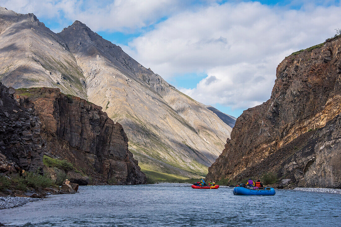 Rafters among canyon walls on the Marsh Fork of the Canning River in the Arctic National Wildlife Refuge, Summer, Alaska