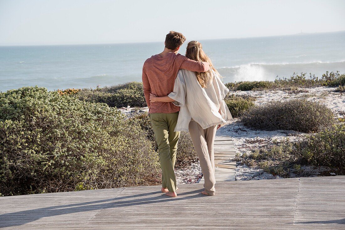 Happy couple enjoying on the beach