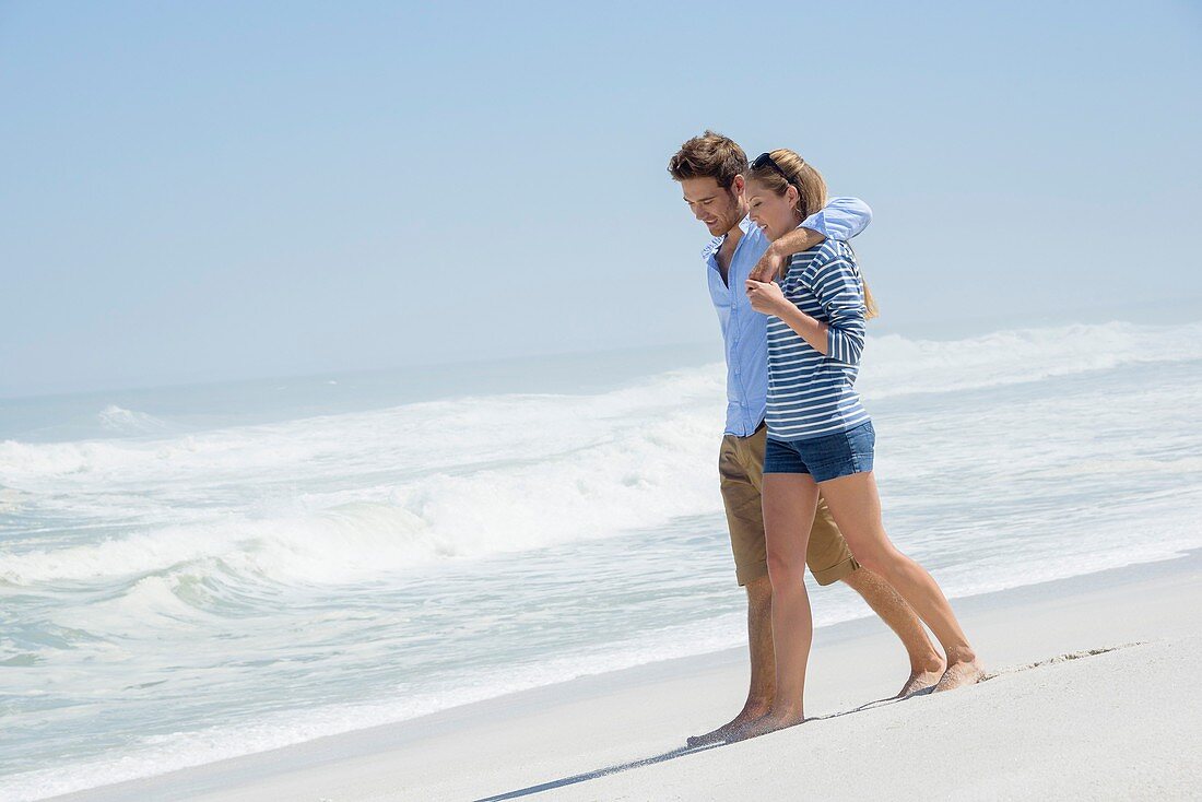 Couple walking on the beach