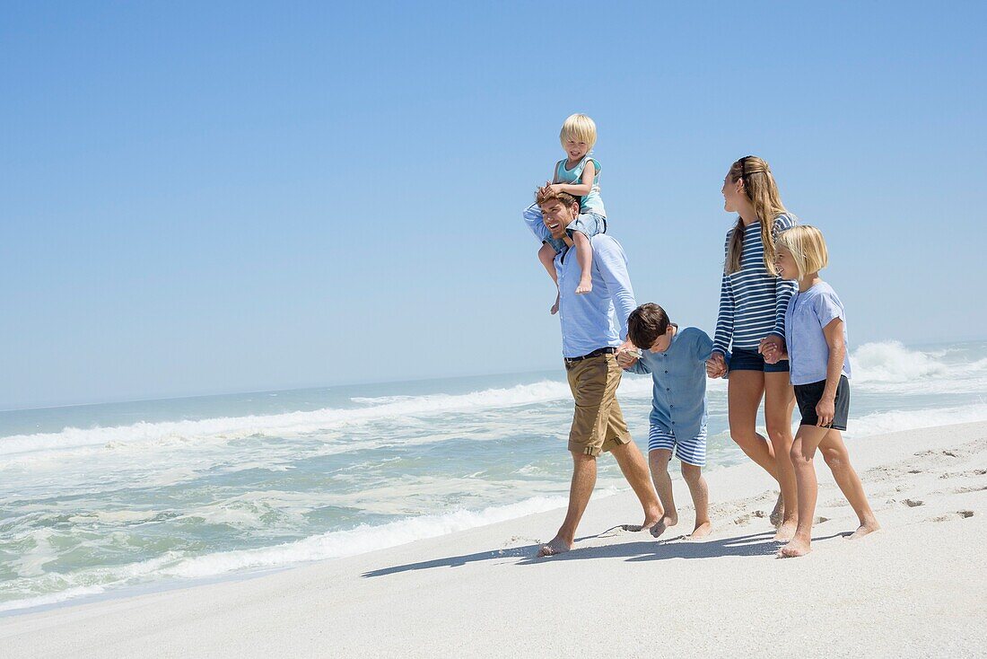 Family walking on the beach