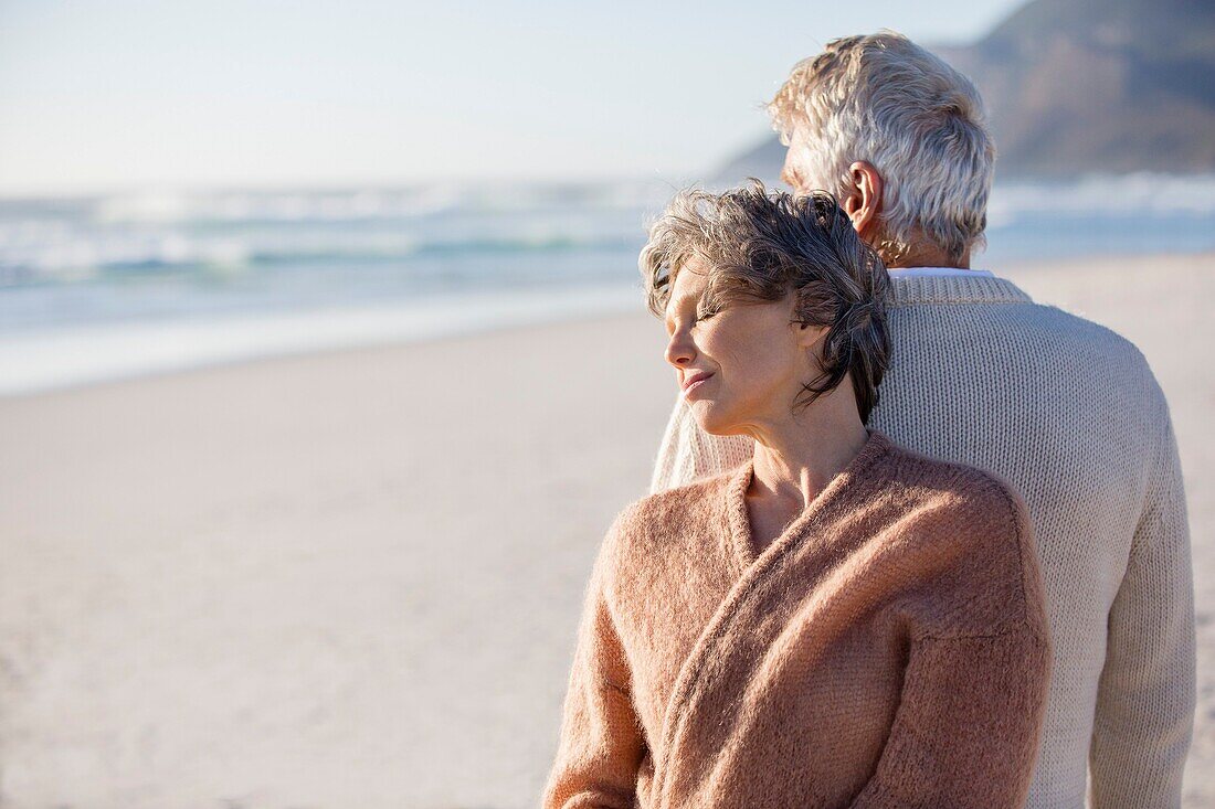 Close-up of an old couple on the beach