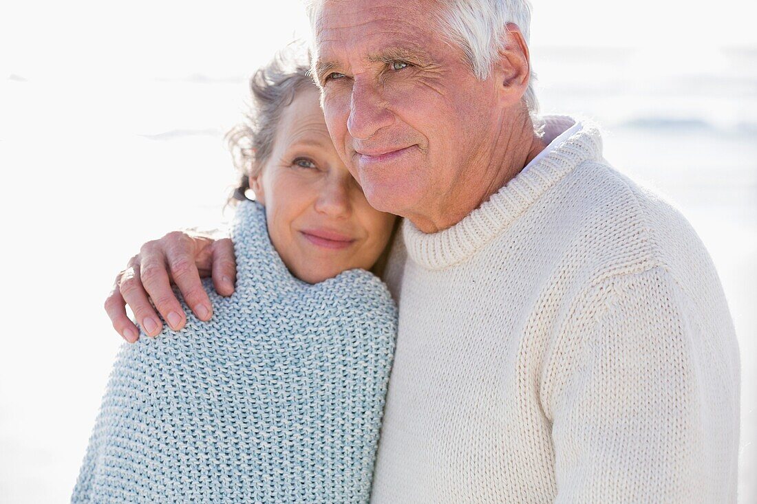 Close-up of a couple embracing each other on the beach