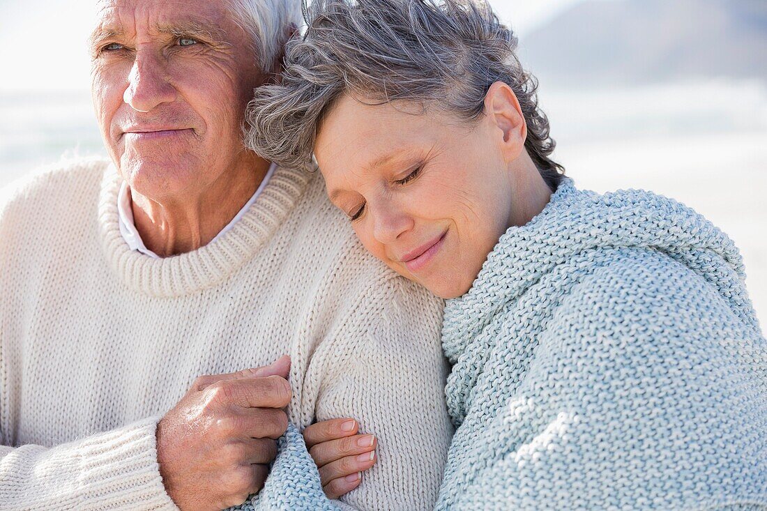 Woman relaxing on the shoulder of her husband