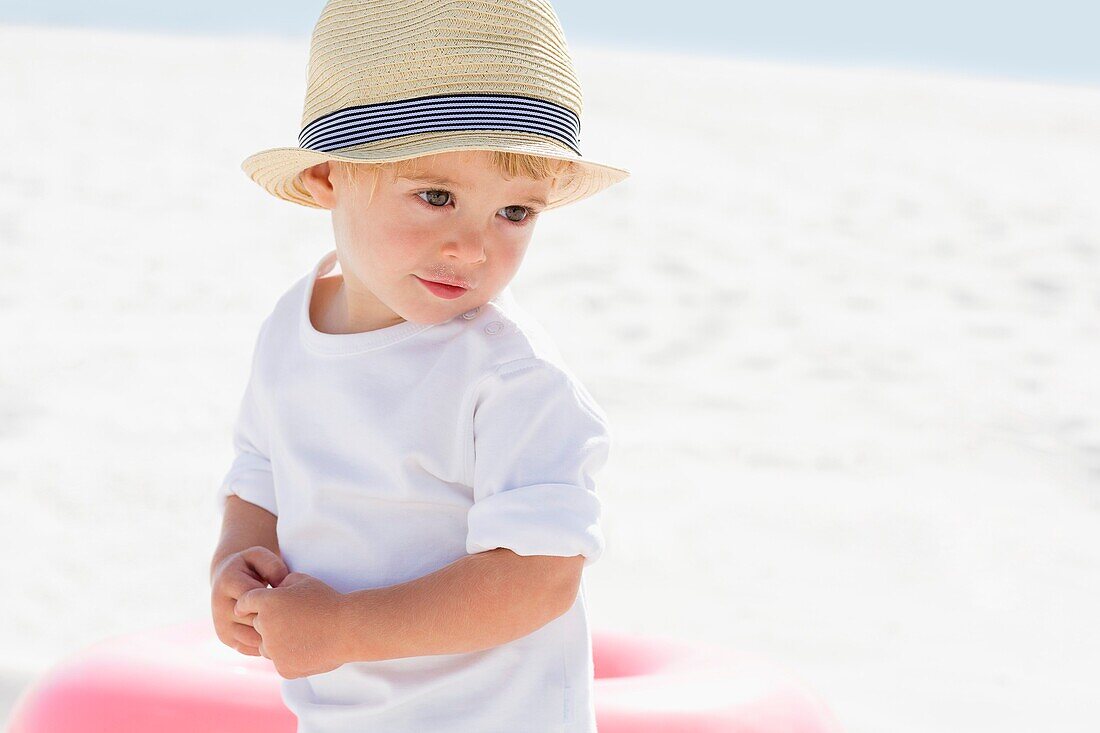 Close-up of a baby boy on the beach
