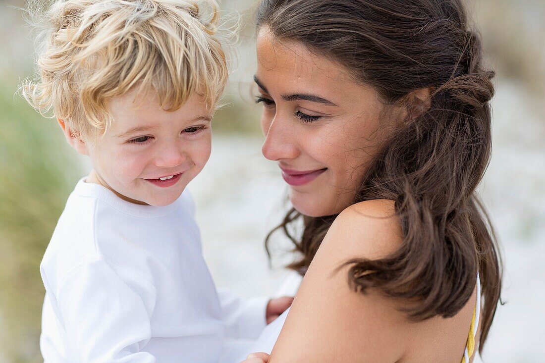 Close-up of a woman loving with her son