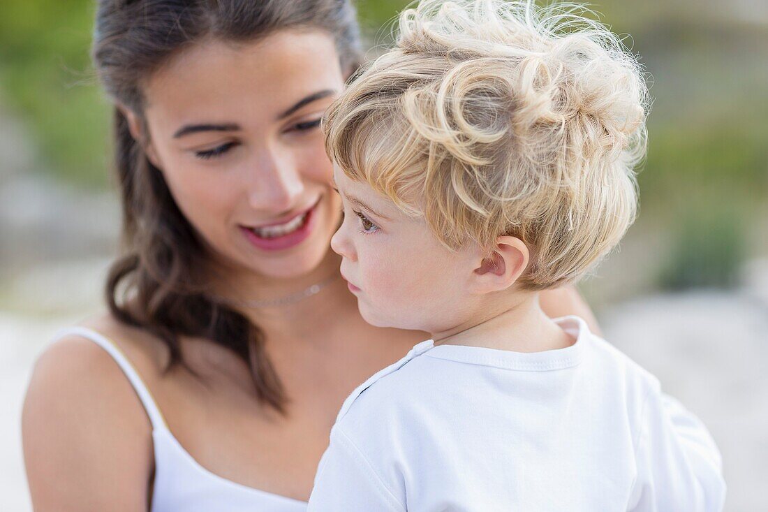 Close-up of a woman looking at her baby