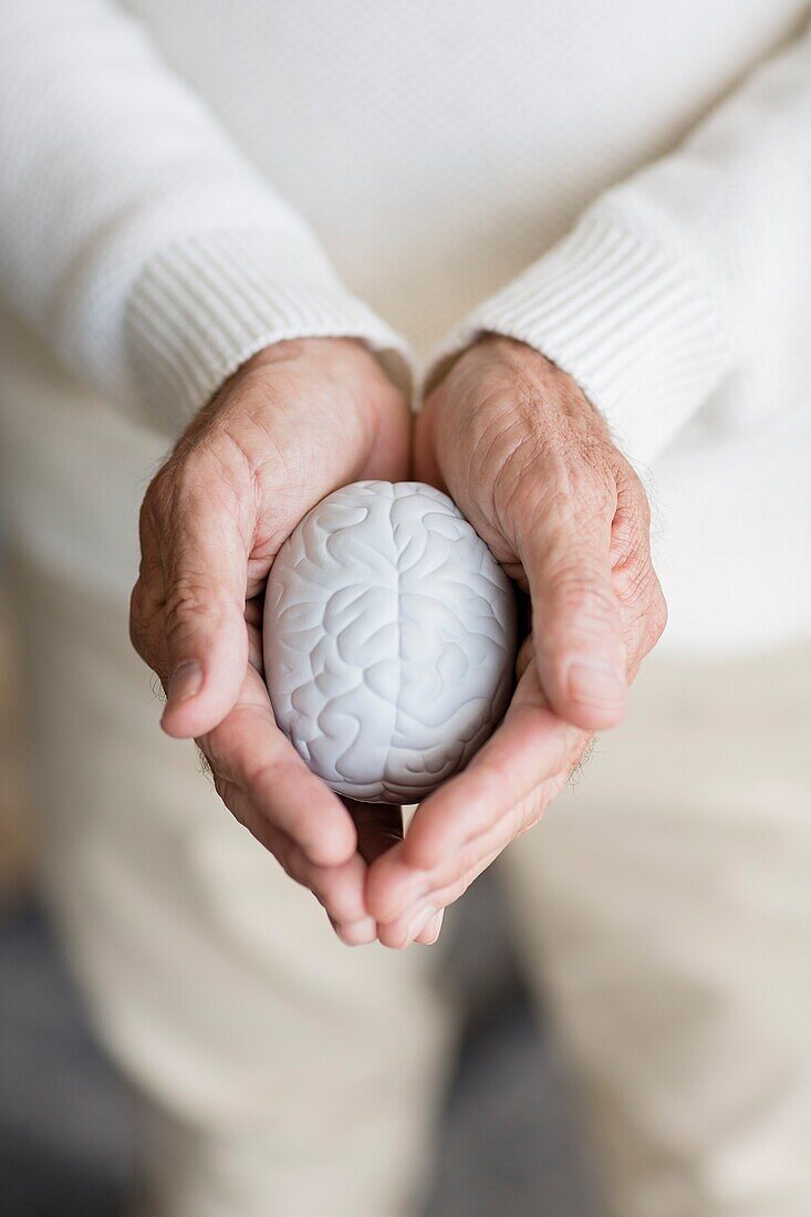 Senior man holding a stress ball