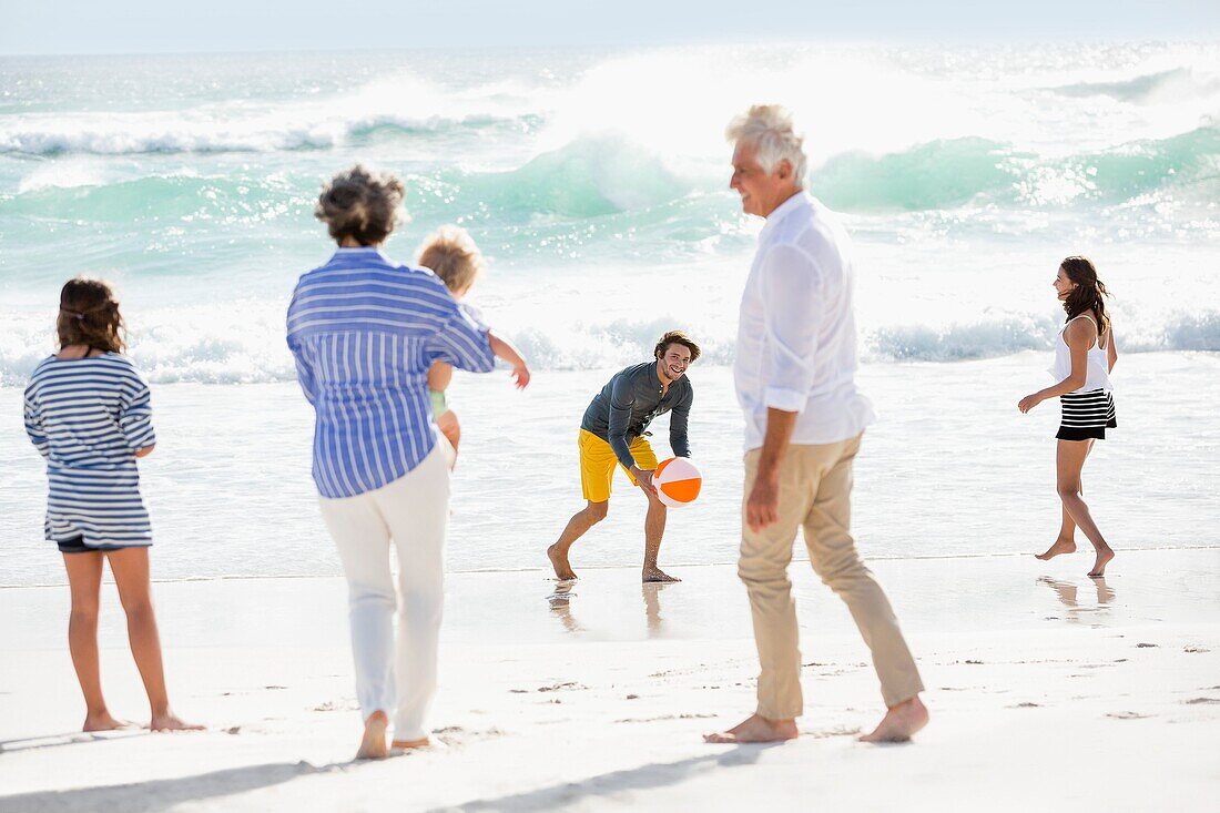 Multi-generation family enjoying on the beach