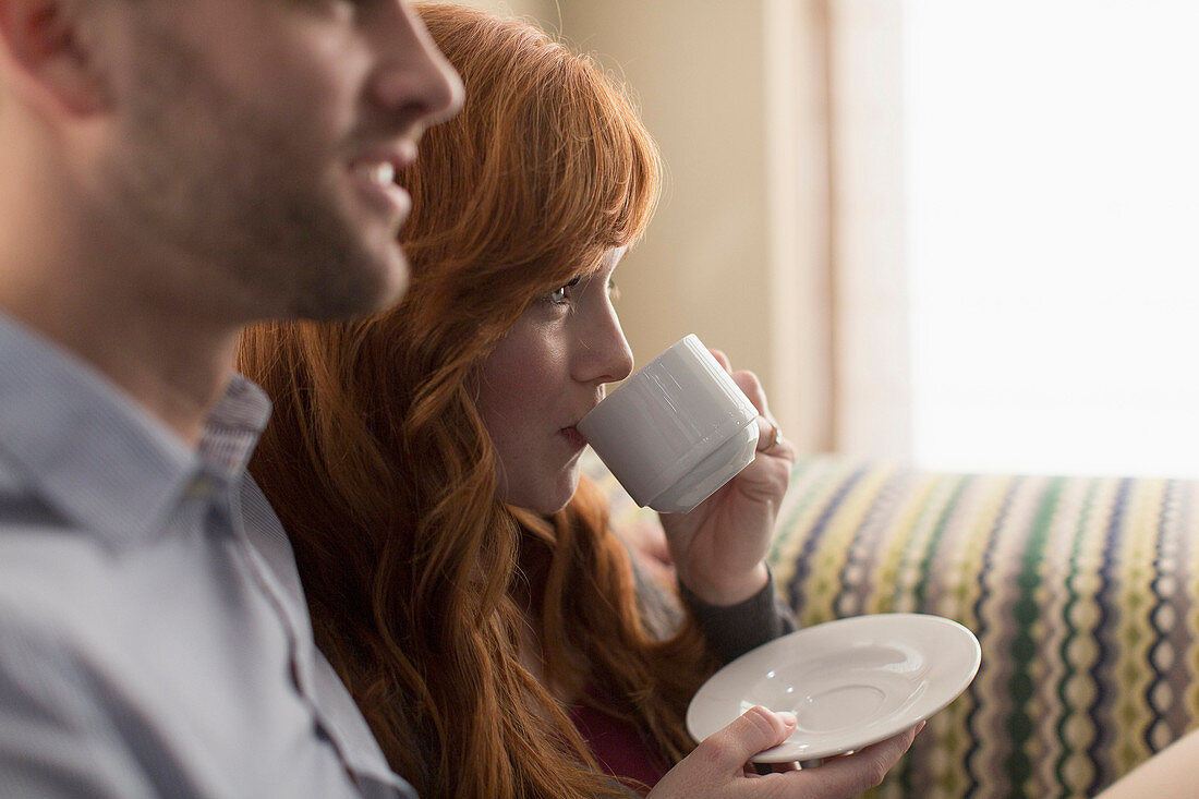 A lovely young couple enjoys coffee