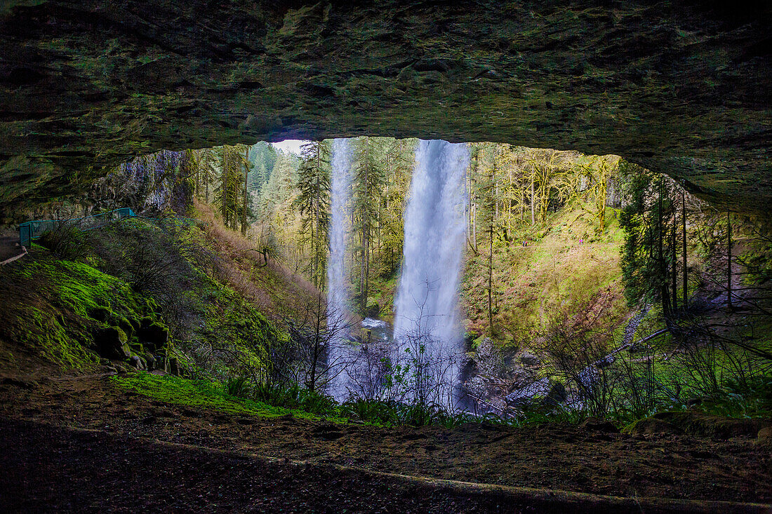 View from behind North Falls on a part of the Trail of Ten Falls that goes behind the waterfall at Silver Falls State Park in Oregon