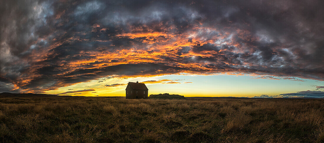 'Abandoned house in rural Iceland with a beautiful sunset in the sky; Iceland'