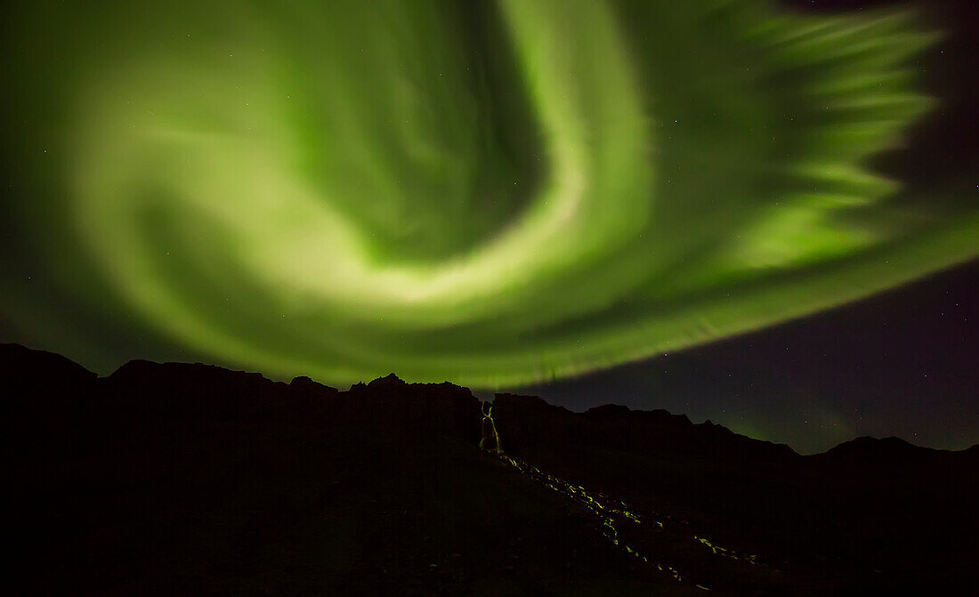 'Northern lights over top of the town known as Djupavik along the Strandir Coast; Djupavik, Iceland'