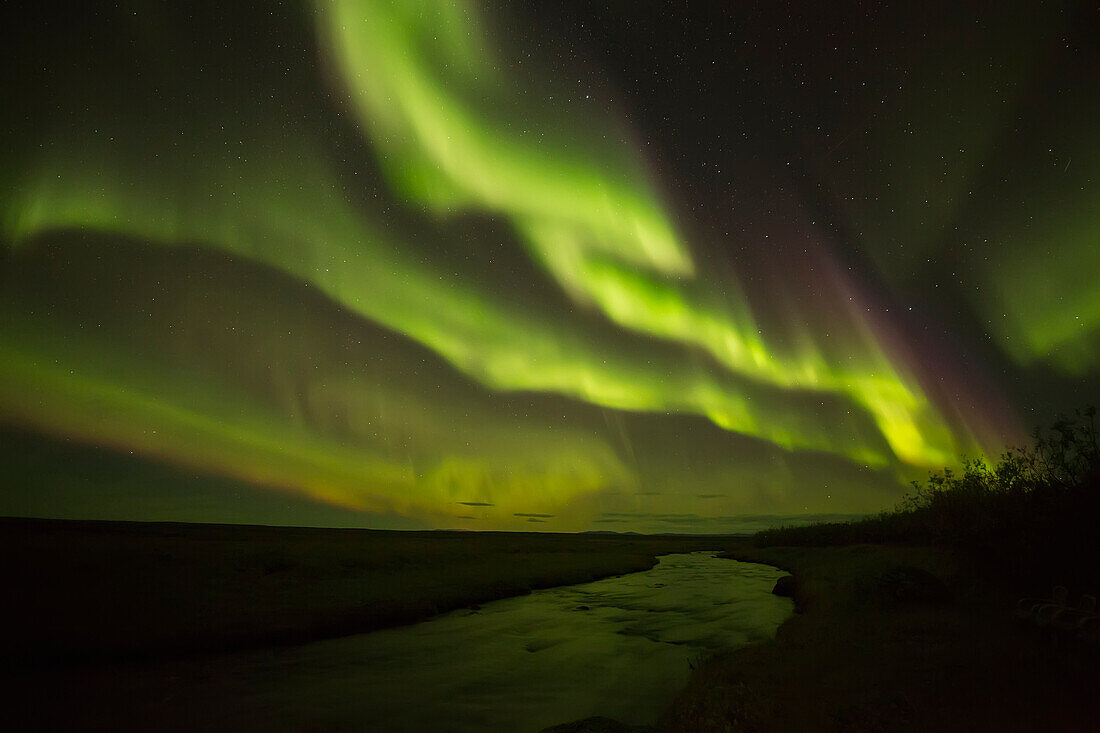 'Aurora borealis over a small stream; Iceland'