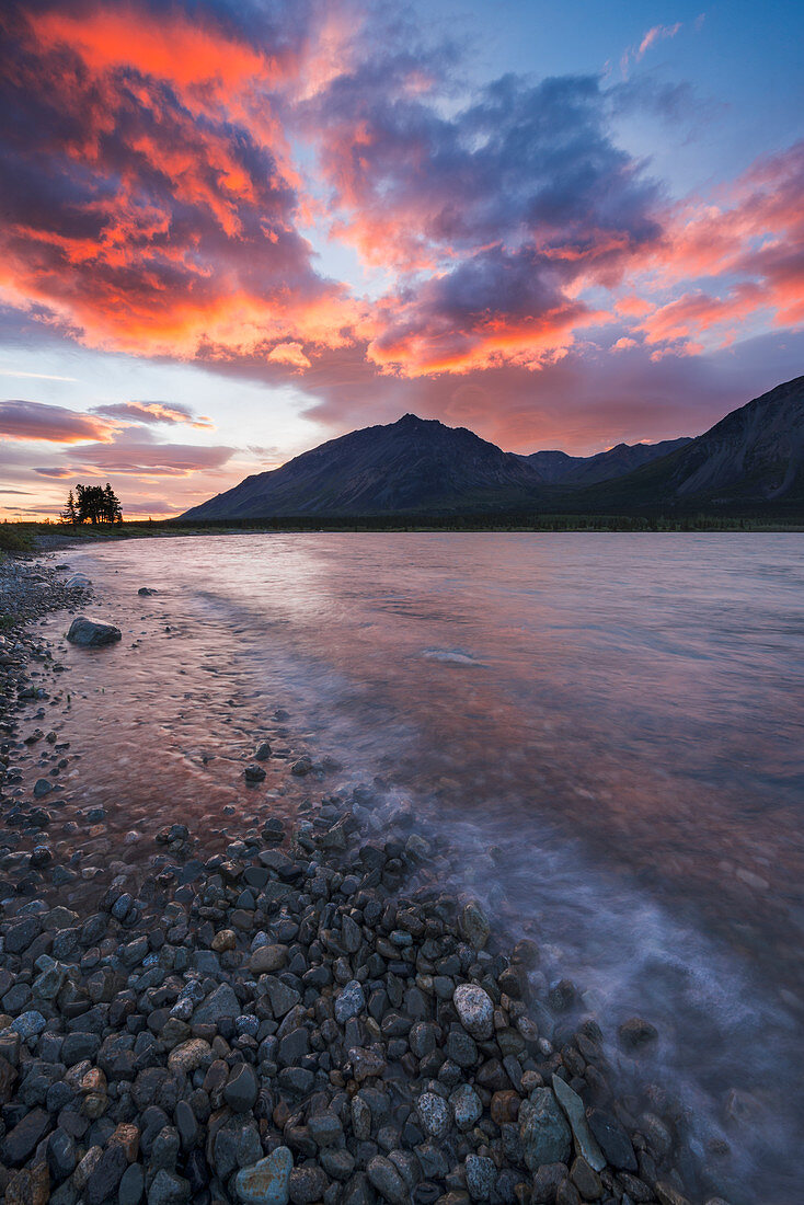 Colors of sunset fill the sky over upper Twin Lake in Lake Clark National Park & Preserve, Alaska.