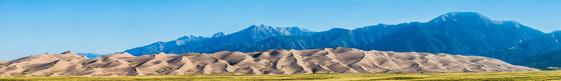 'Panoramic view of the sand dunes and Sangre de Cristo Mountains in Great Sand Dunes National Park and Preserve; Colorado, United States of America'