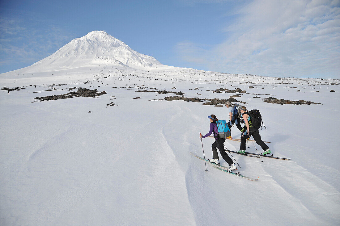 Skiers ascend the Northeast flanks of  Mt Augustine, a 4,025-foot high active volcano on Augustine Island in Cook Inlet, Alaska. The lava dome volcano is part of the Ring of Fire and last erupted in 2006.