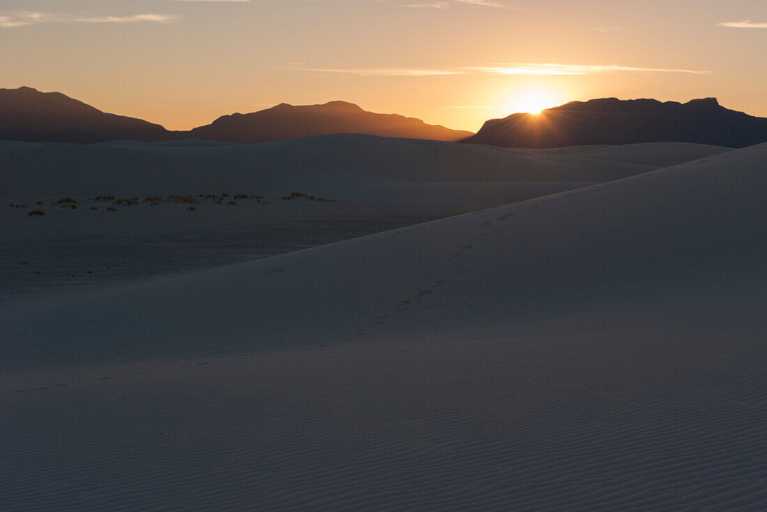 Sunset over dunes at White Sands National Monument, New Mexico, USA