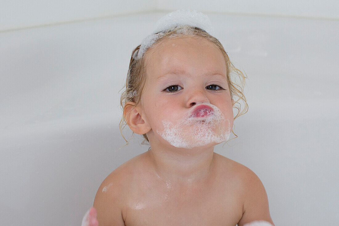 Little girl taking bath