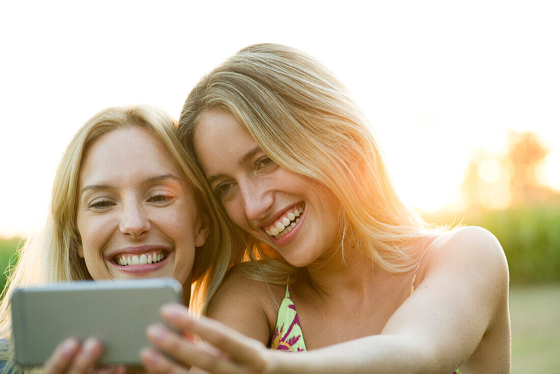 Couple posing for smartphone selfie