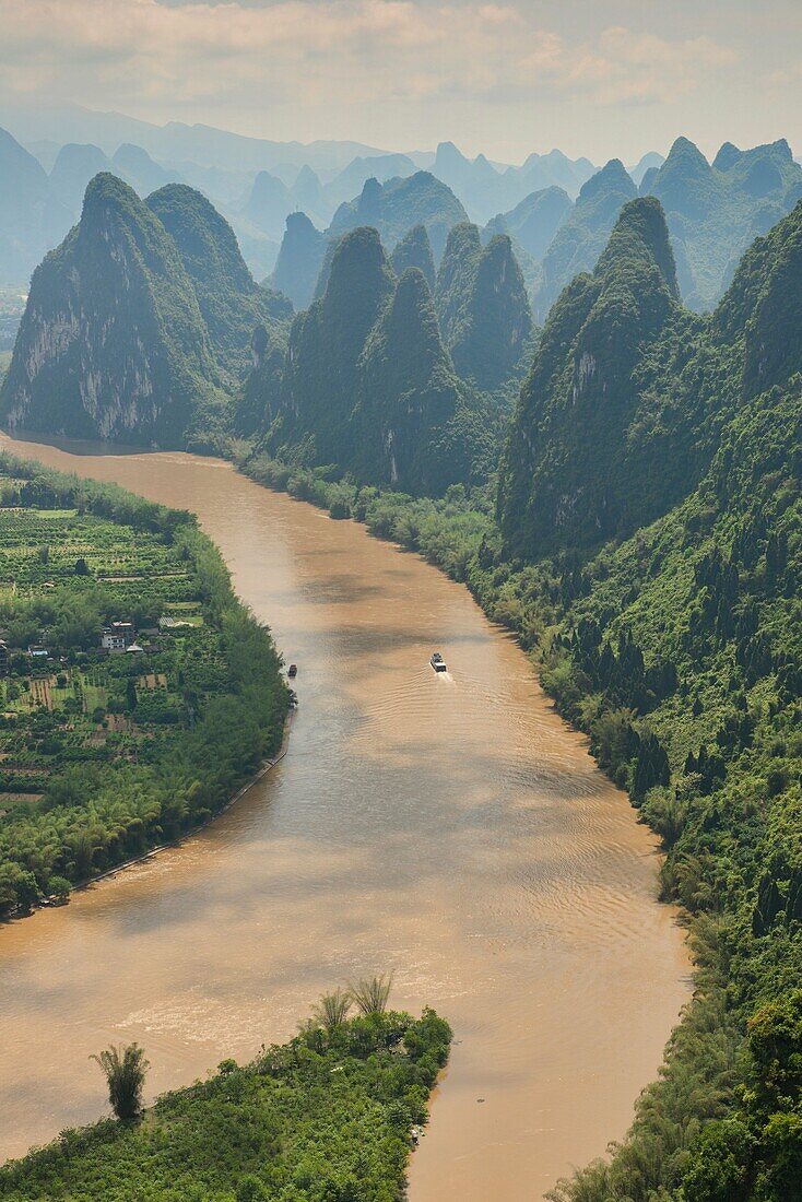 Boat traveling up the scenic Li River, Xingping, Guangxi Autonomous Region, China.