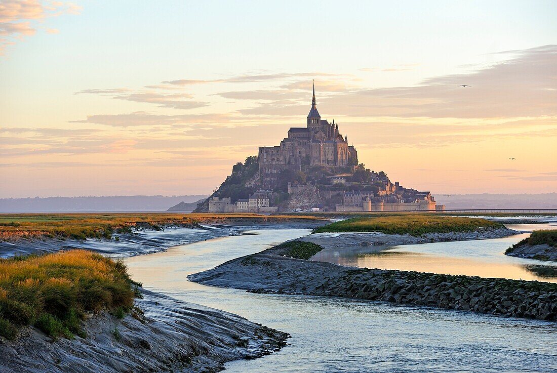 Mont-Saint-Michel in the mouth of the Couesnon river at sunrise, Manche department, Normandy region, France, Europe.