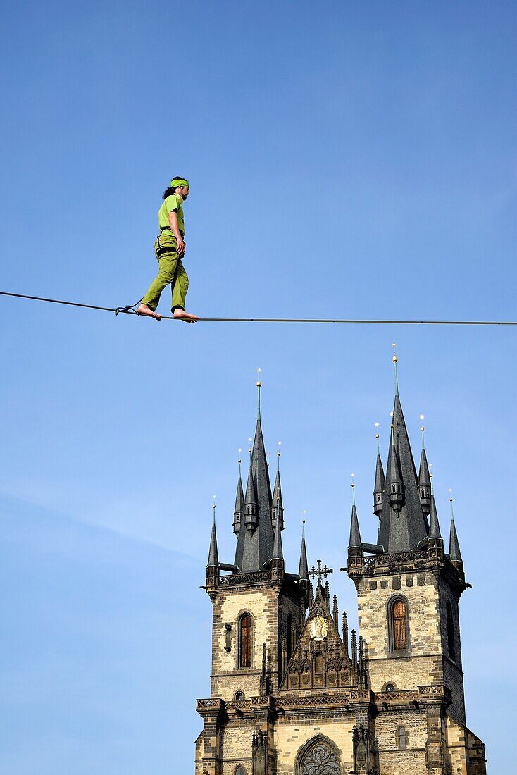 Czech Republic, Prague, historic centre listed as World Heritage by UNESCO, the Old Town (Stare Mesto), Old Town Square (Staromestske namesti), Our Lady of Tyn Church and a tightrope walker (funambulist).