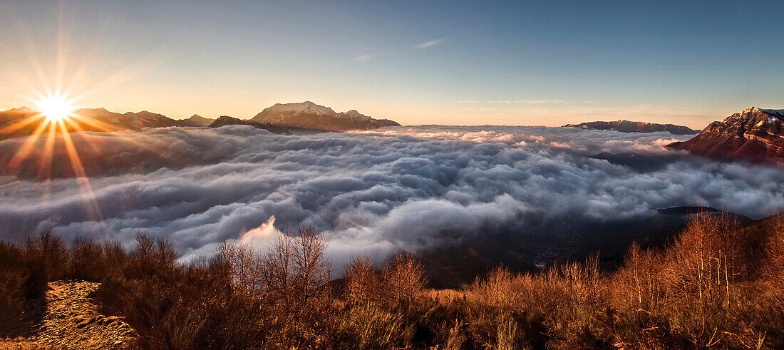 Italy, Lombardy, Como district. Como Lake, Clouds carpet, dawn, mount grona