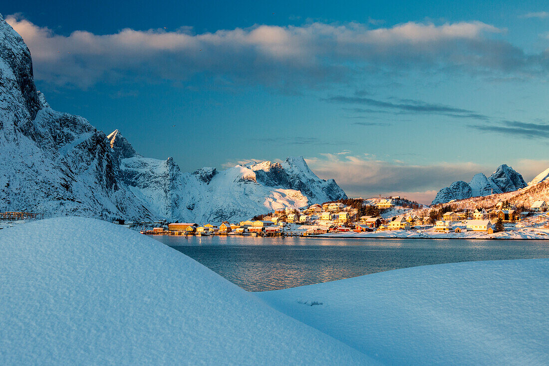 The blue color of dusk on the fishing village and the snowy peaks Kvalvika And?©ya Reine Nordland Lofoten Islands Norway Europe