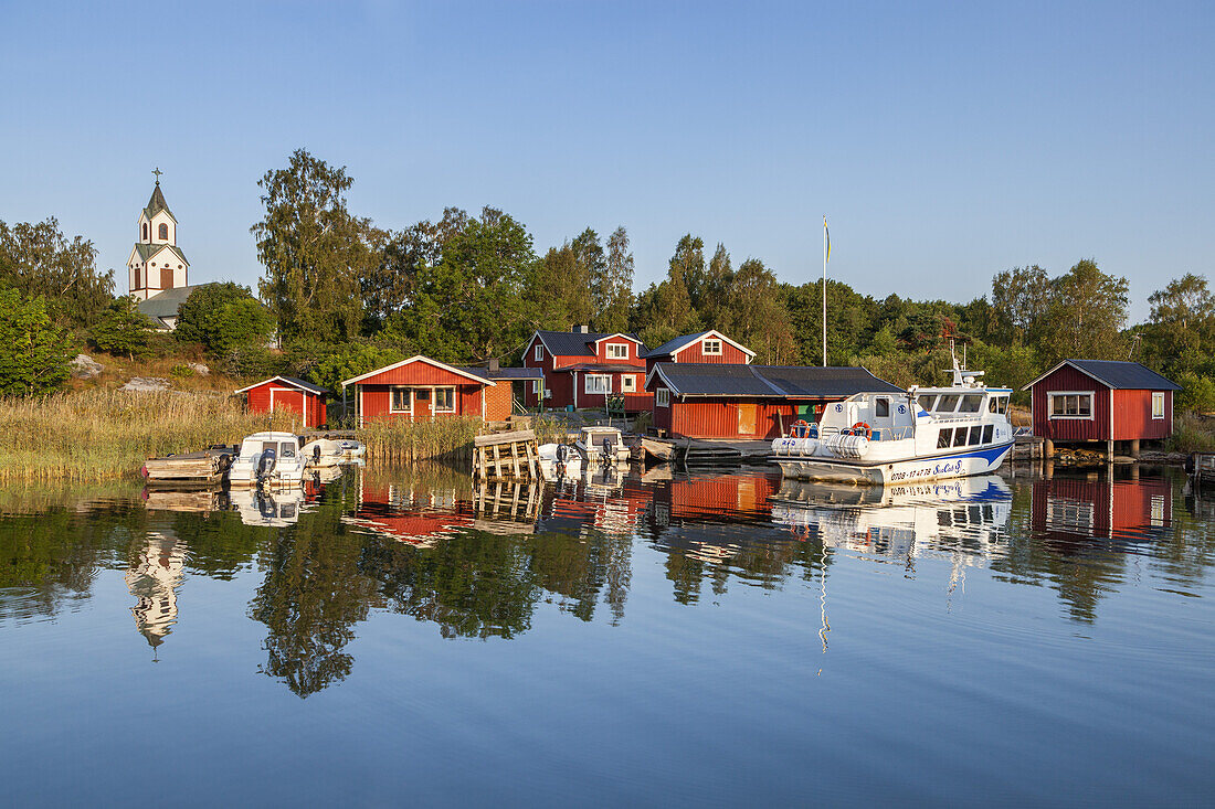 Harbour and church in Berg on the island of Moeja, Stockholm archipelago, Uppland, Stockholms land, South Sweden, Sweden, Scandinavia, Northern Europe