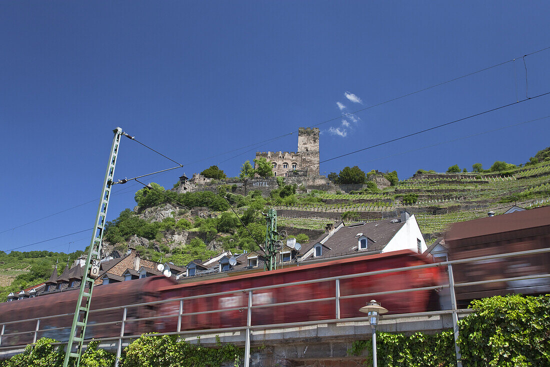 Rail cargo underneath Burg Gutenfels Castle, Kaub, Upper Middle Rhine Valley, Rheinland-Palatinate, Germany, Europe