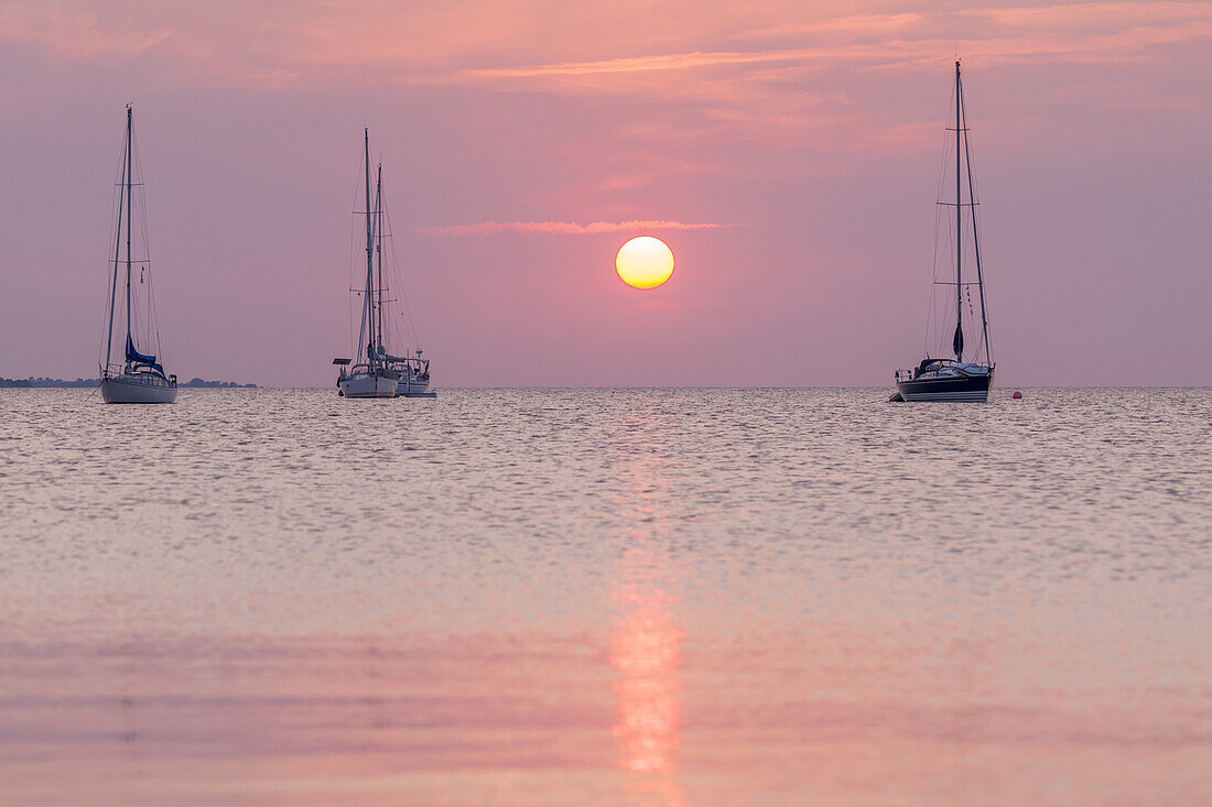 Sailboats in the sunset over the Baltic Sea near Ærøskøbing, Island Ærø, South Funen Archipelago, Danish South Sea Islands, Southern Denmark, Denmark, Scandinavia, Northern Europe