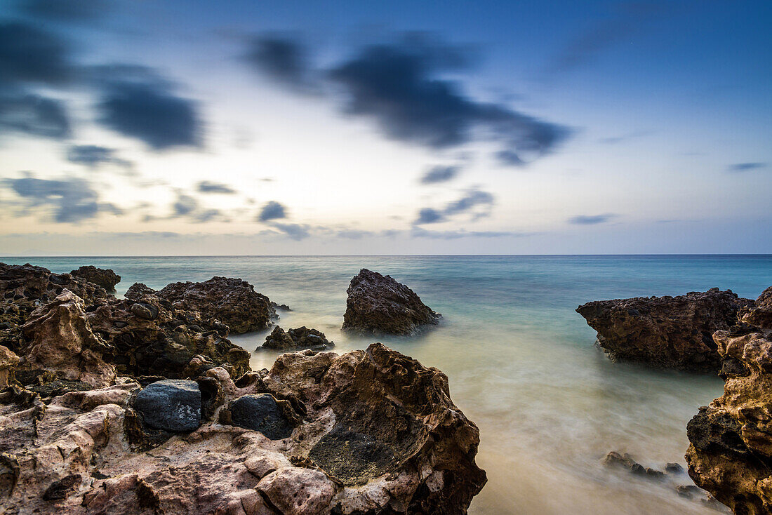 Rocks and stones on the beach Playa del Matorral at Morro Jable in the morning mood. Morro Jable, Fuerteventura, Canary Islands, Spain