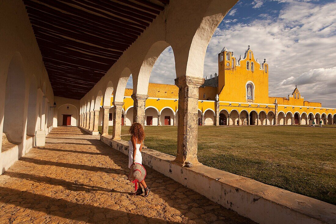 Woman posing at Izamal convent, Monastery-Convent Of San Antonio De Padua, Izamal, Yucatan, Yucatan Province, Mexico, Central America.