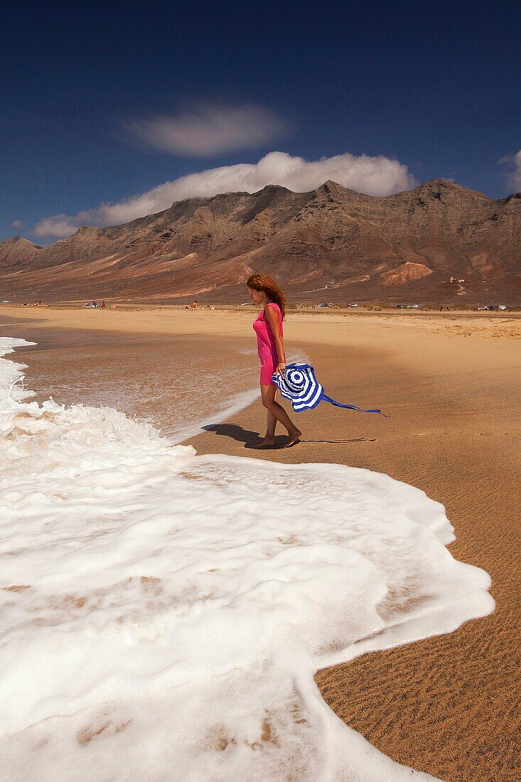 Woman at Playa de Cofete beach, Fuerteventura, Canary Islands, Spain, Europe.