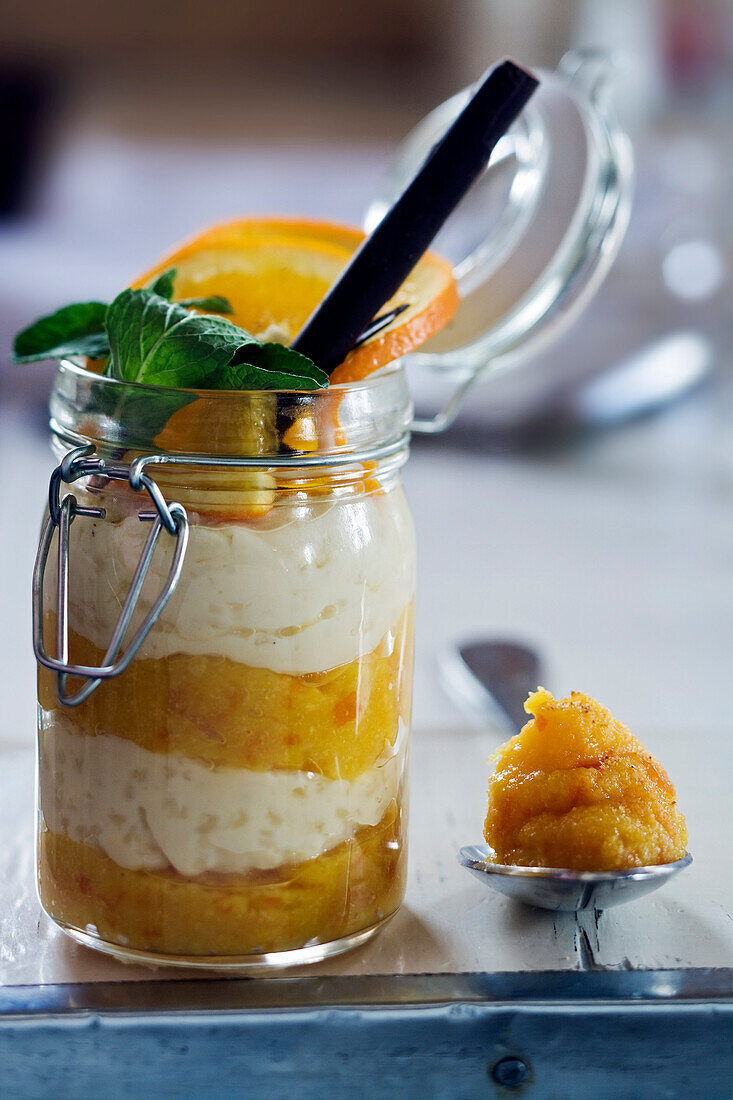 France, Savoie, Val d'Isere, altitude chalet at the summit of La Daille cable car at 2290m, La Fruitiere Restaurant, owner Luc Reversade, rice pudding in verrine glass, bitter orange marmalade