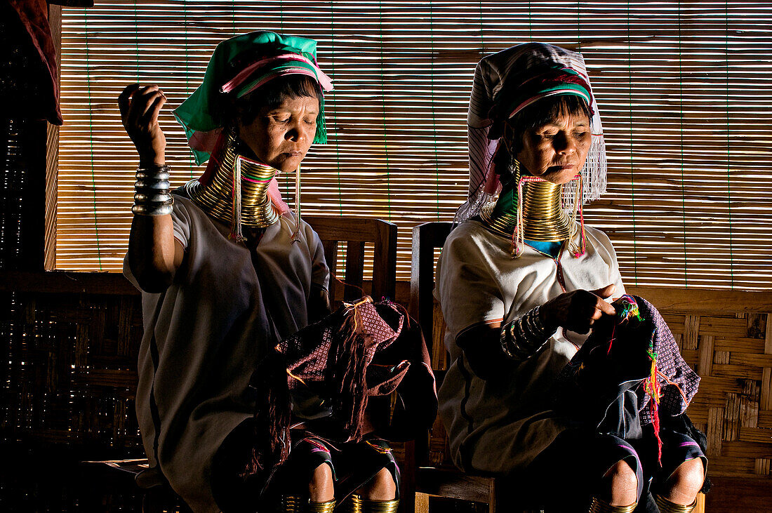Myanmar (Burma), Shan State, Inle Lake, village of Ywama, workshop Thitsar Hinn, Moekran and Moena from the Padaung tribe emigrated to Ywama to earn a living by weaving traditional fabrics Padaung