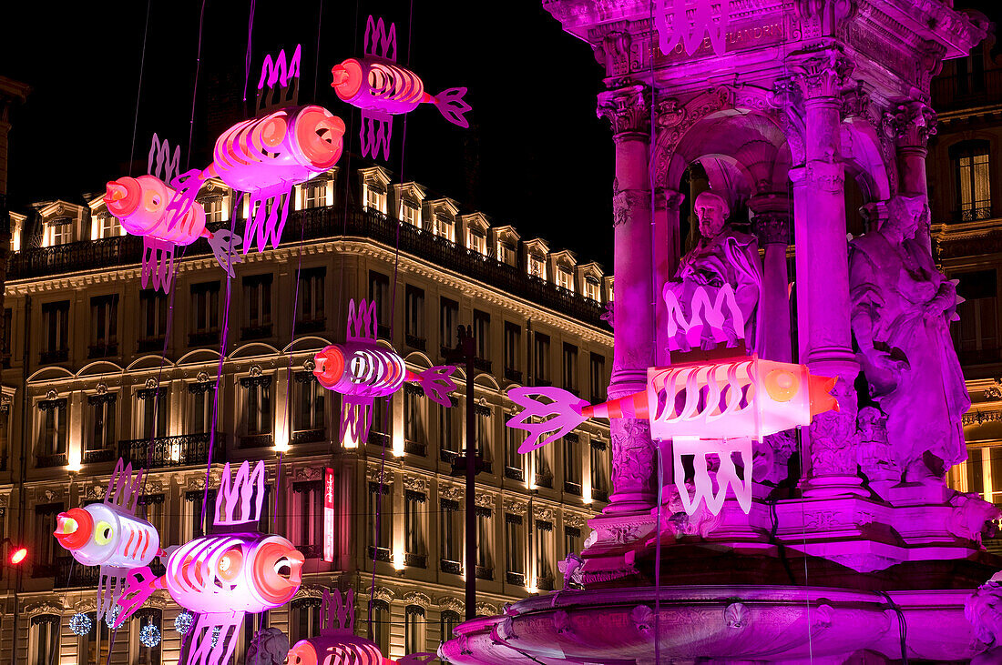 France, Rhone, Lyon, historical site listed as World Heritage by UNESCO, Fete des Lumieres (Light Festival), fountain in Place des Jacobins (Jacobins square), installation art called La Fontaine aux Poissons by artist Bibi