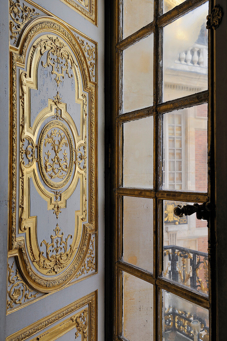 France, Yvelines, Chateau de Versailles, listed as World Heritage by UNESCO, the King's Apartments, shutter and window of the King's bedroom looking the Cour de Marbre (Marble Courtyard)