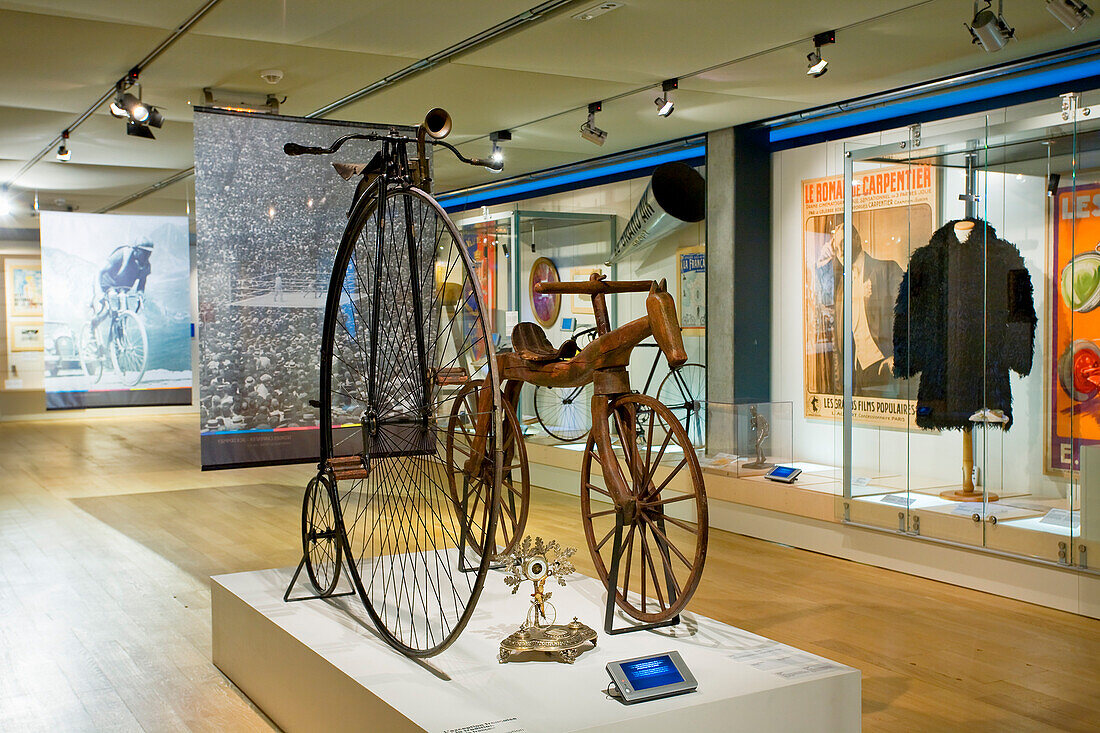 France, Paris, Musee National du Sport, Penny-farthing (high wheel) and wooden dandy horse (also known as Laufmaschine or draisine) velocipedes, forerunners of modern bicycle