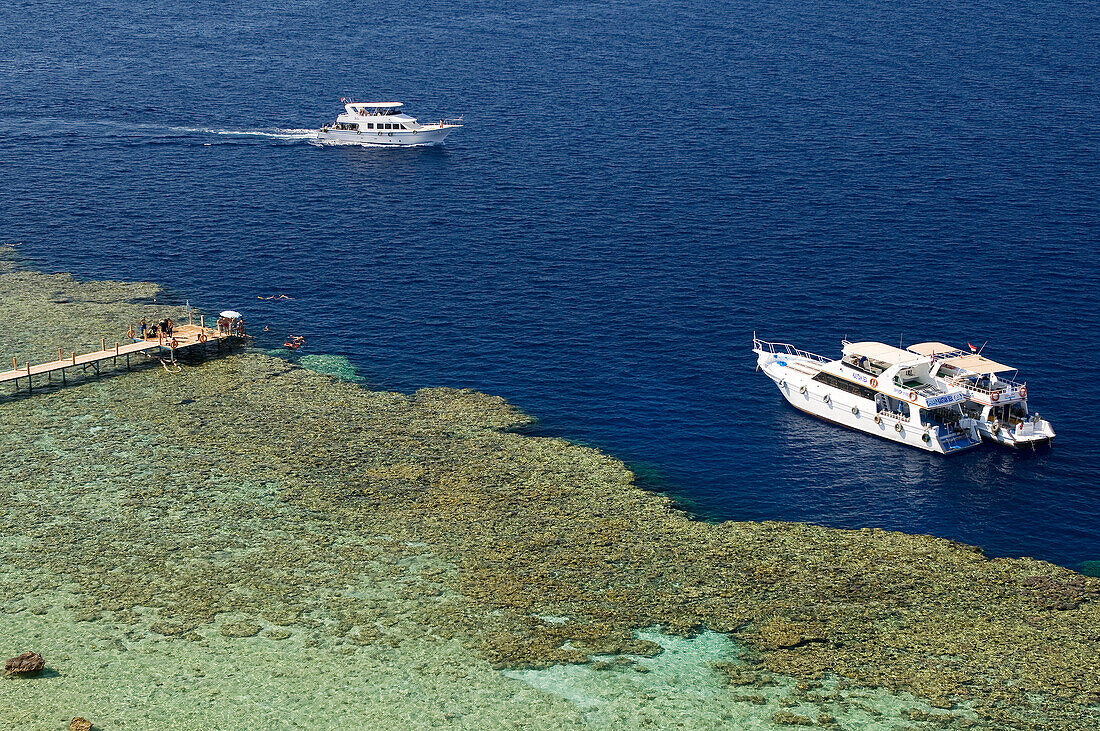 Egypt, Red Sea, coral reef and diving boats
