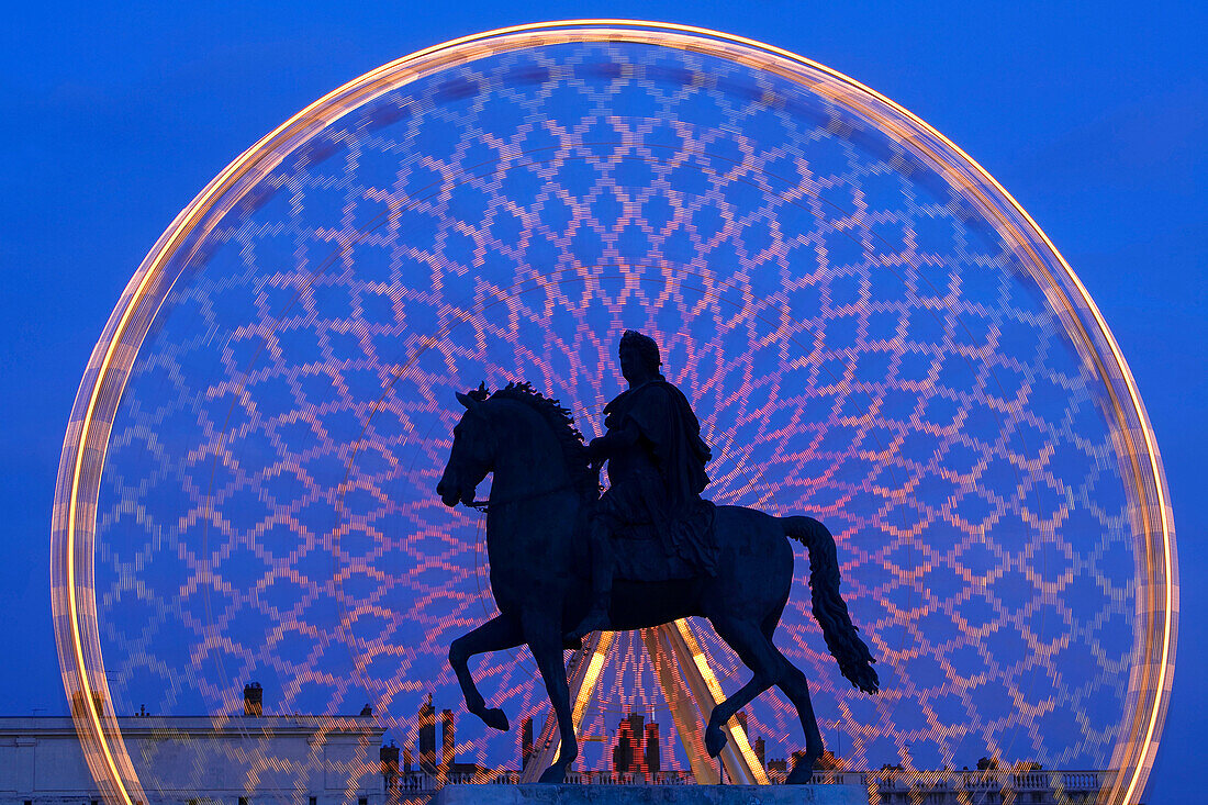 France, Rhone, Lyon, historical site listed as World Heritage by UNESCO, the great wheel on place Bellecour (Bellecour Square) and equestrian statue of Louis XIV